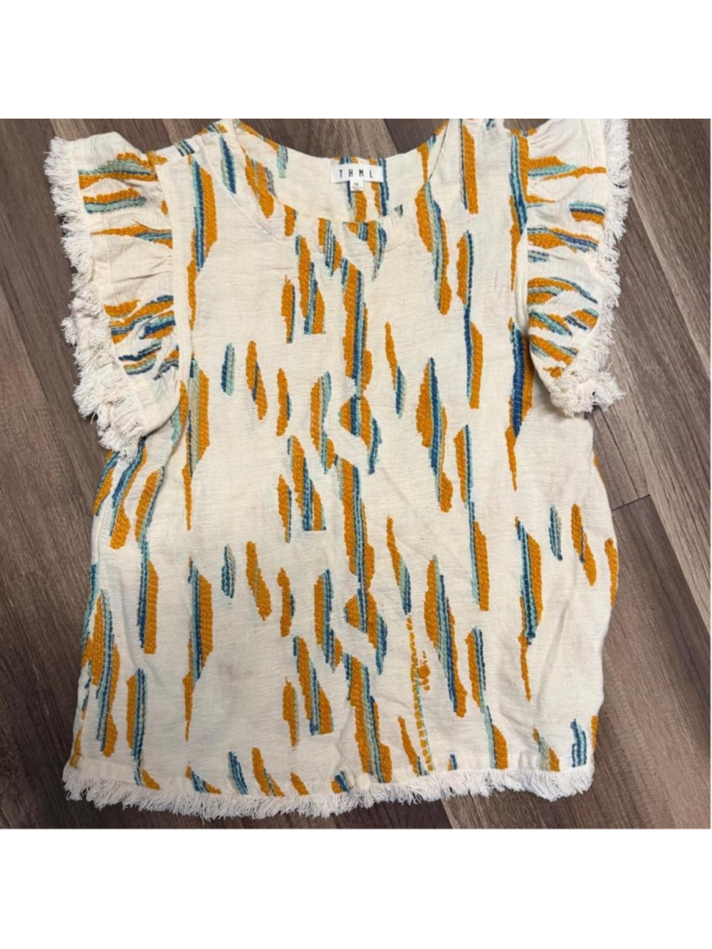 Boho embroidered fringe tunic top with a textured woven design in mustard yellow